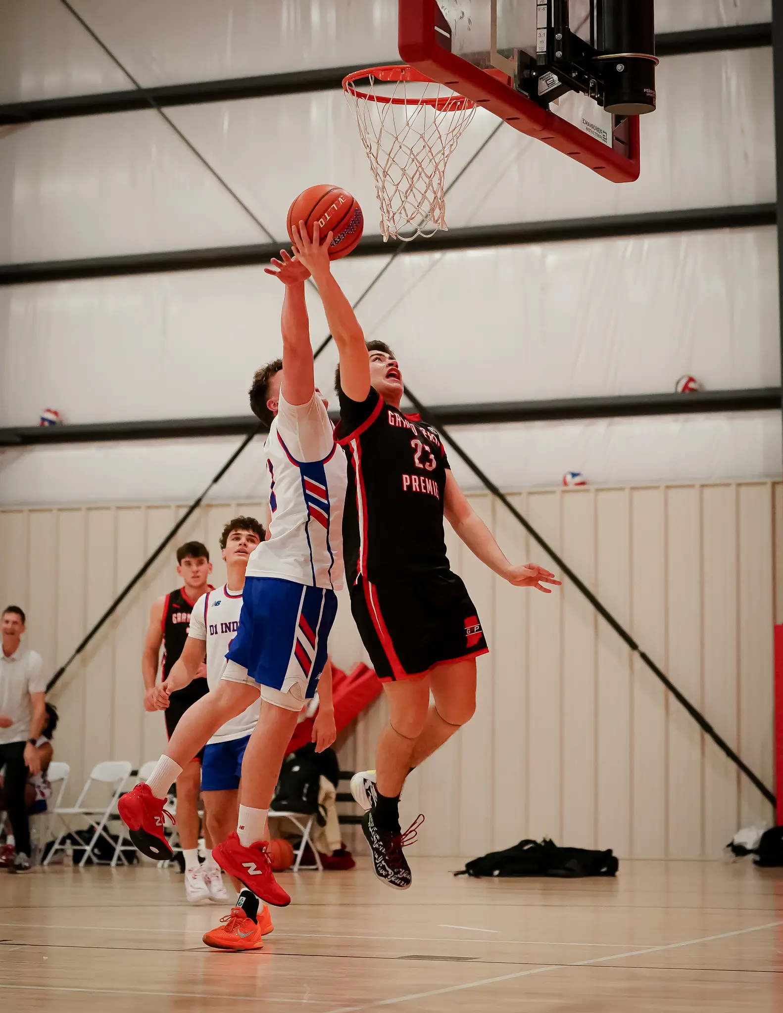 Carlos Lopez finishing a contested layup